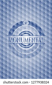 Monumental blue badge with geometric pattern.