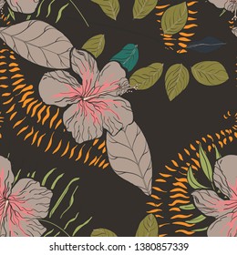 Moody floral tropical pattern design with hibiscus flowers and leaves on dark background. Exotic seamless pattern with tropical leaves. Ethnic Background with Hawaiian flowers and plants.