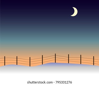 Moon over snow-covered field in winter