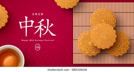 Mooncake on bamboo mat and teacup, Chinese translation is blessing and Mid Autumn. Top view of tea ceremony with cookies, China holiday poster design.