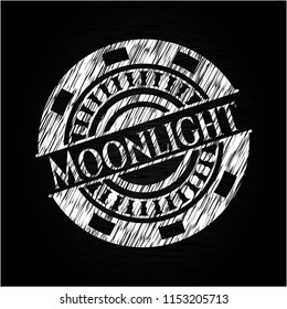 Moonlight chalk emblem written on a blackboard