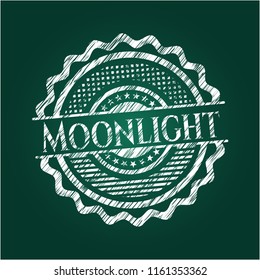 Moonlight chalk emblem written on a blackboard
