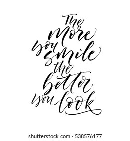 The more you smile the better you look postcard. Ink illustration. Modern brush calligraphy. Isolated on white background.