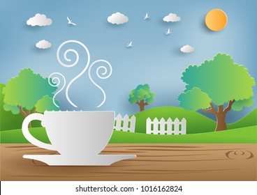 Morning coffee on wooden table with beautiful view background,paper art style.