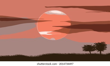 Morning glow on the grassland. The great red sun rises.