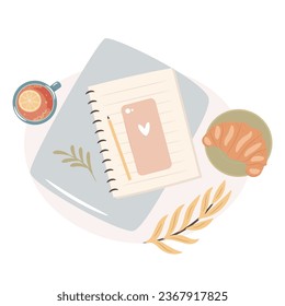 Morning tea with croissant, laptop and notepad. Cozy autumn working days concept.