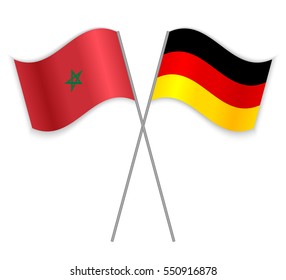Moroccan and German crossed flags. Morocco combined with Germany isolated on white. Language learning, international business or travel concept.