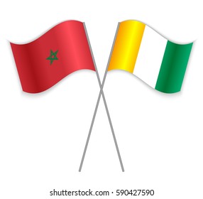 Moroccan and Ivorian crossed flags. Morocco combined with Ivory Coast isolated on white. Language learning, international business or travel concept.