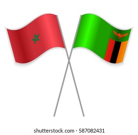 Moroccan and Zambian crossed flags. Morocco combined with Zambia isolated on white. Language learning, international business or travel concept.