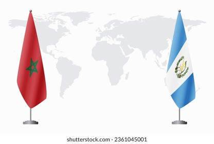 Morocco and Guatemala flags for official meeting against background of world map.