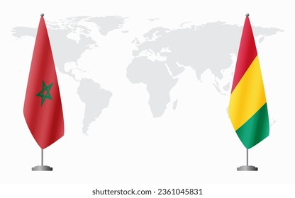 Morocco and Guinea flags for official meeting against background of world map.