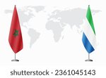 Morocco and Sierra Leone flags for official meeting against background of world map.