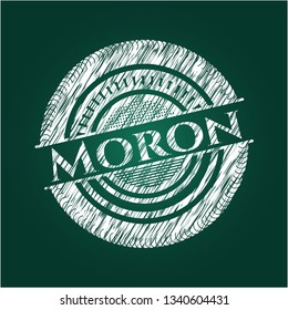 Moron chalk emblem written on a blackboard