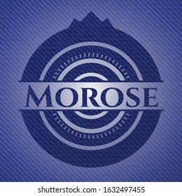 Morose badge with denim texture. Vector Illustration. Detailed.