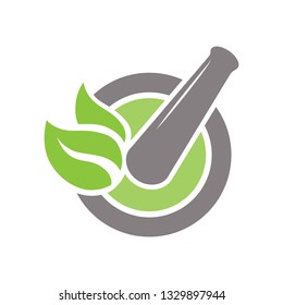 Mortar and pestle with green leaves, vector logo icon