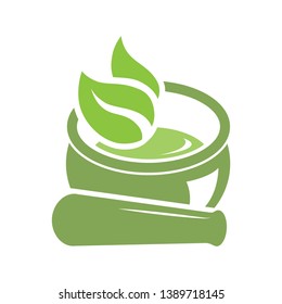 Mortar and pestle with green leaves, vector logo icon