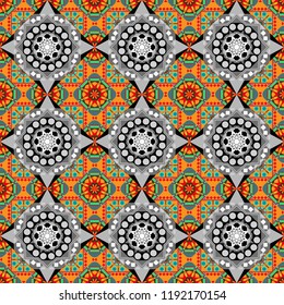Mosaic background in gray, orange and black colors. Vector abstract patch seamless pattern.
