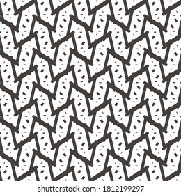 Mosaic decoration with speckled angular pieces. Black and white pattern for textiles and to cover flat surfaces.
