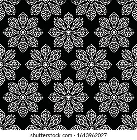 Mosaic flowers seamless pattern. Dotted flower shapes in chess order. Black and white vector illustration.