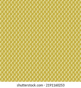 A mosaic made of small squares and triangles in gold and ivory tones. Fashion pattern. Textile design.