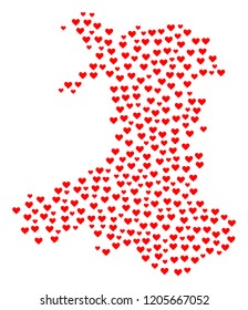 Mosaic map of Wales composed with red love hearts. Vector lovely geographic abstraction of map of Wales with red romantic symbols. Romantic design for bonus projects.
