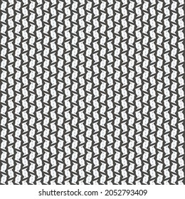 Mosaic pattern, consisting of small patches marked with a few stitches. Textile design in black and white.