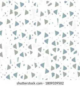 Mosaic with pieces in shades of gray and blue, positioned at different distances on a white support. Ceramic tile.