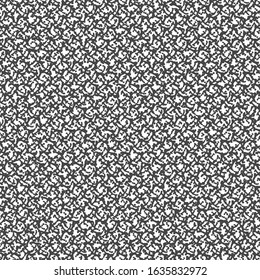 A mosaic of small fragments or irregular shapes. Jute carpet texture. Graphics in black and white.