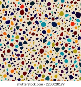A mosaic terrazzo style stone background pattern with irregular geometric polygon shapes.
