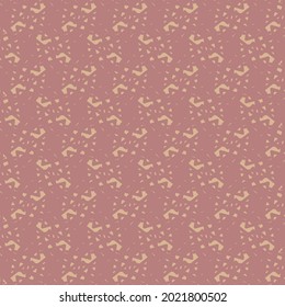 Mosaic textile pattern in shades of pink with a content of small abstract shapes and flecks. Wallpaper design.