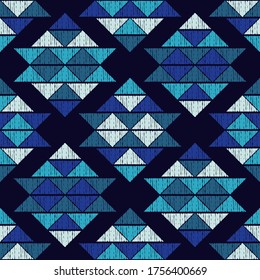 Mosaic of triangles. Blue. Seamless pattern. Geometry. Design with manual hatching. Textile. Ethnic boho ornament. Vector illustration for web design or print.