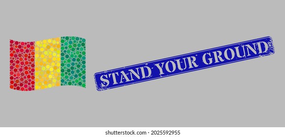 Mosaic waving Guinea flag designed with circle pixels, and distress Stand Your Ground rectangle watermark. Vector dots are united into waving Guinea flag collage.
