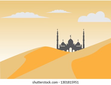 a mosque building in the middle of the desert