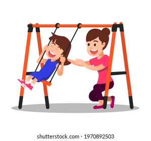 A mother accompanies her daughter on a swing