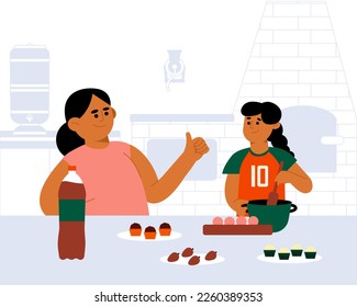 Mother and child cooking some typical Brazilian sweets like "brigadeiro", coconut sweet "beijinho"and strawberry.