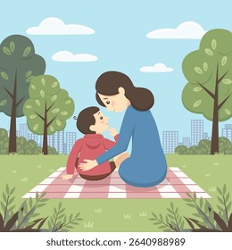 mother with child on picnic on sunny day in park