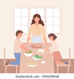Madre e hijos en la mesa de la cocina y pasarlo bien juntos. Una mujer, un hijo y una hija preparan la cena y se divierten. El concepto de maternidad, familia y amistad