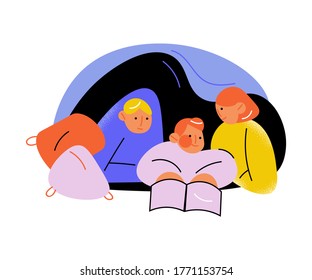 Mother with children lying and reading book in pillow house at home