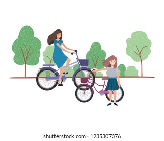 mother and daughter with bicycle in landscape