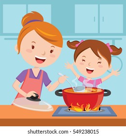 Mother And Daughter Cooking Together