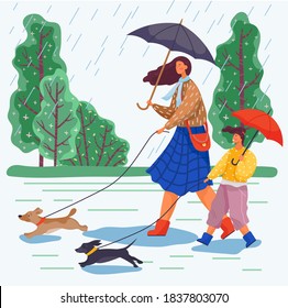 Mother and daughter go for a walk with umbrellas in the rain and take their dogs with them. Happy family day walk during terrible rainy weather. Dogs run forward and lead a couple of young ladies