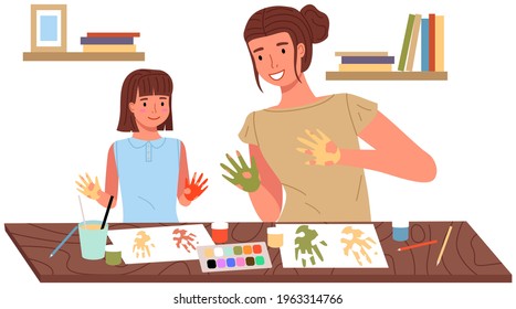 Mother And Daughter Painting At Home. Mom And Child Study Or Playing Together. Woman Teaches Girl To Draw. Happy Family Pastime. People Paint Hands With Dye And Leaves Traces Of Palms On Paper