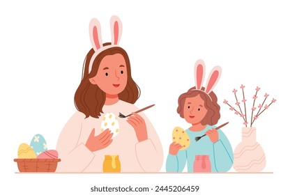 Mother and daughter in rabbit ears paint Easter eggs.Happy family preparing for Easter. 