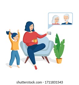 Mother and daughter talk with grandparents using a video call on the phone. The concept of communication with the elderly during quarantine. Laughing happy people communicate using modern technology.
