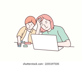 Mother is dizzy working in front of a laptop, child playing next to her korean style