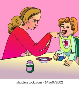 mother feeds a small child at the table