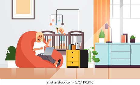 mother freelancer working at home using laptop little son playing with toys in crib coronavirus quarantine self-isolation concept living room interior full length horizontal vector illustration