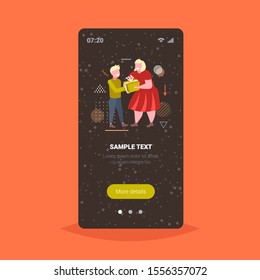 mother giving gift present box to little son merry christmas happy new year winter holidays celebration concept smartphone screen online mobile app full length vector illustration