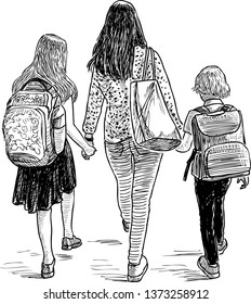 A mother with her kids going to school