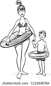Mother with her son walking on a beach. Mother and son with swimming circle